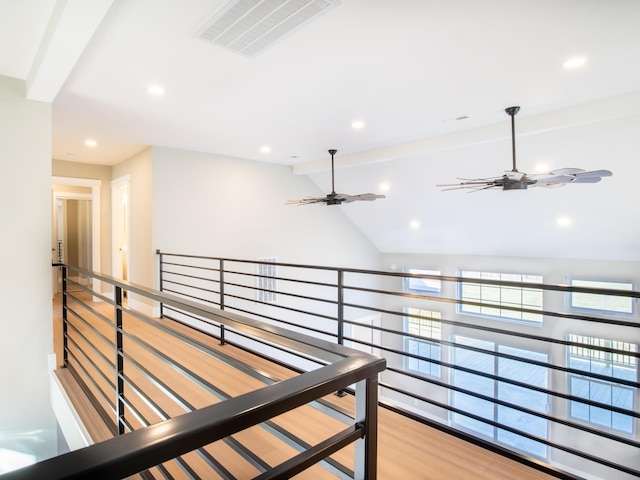 hallway featuring wood-type flooring and lofted ceiling with beams