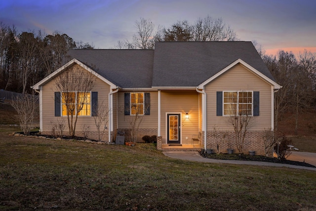 view of front of property with a lawn