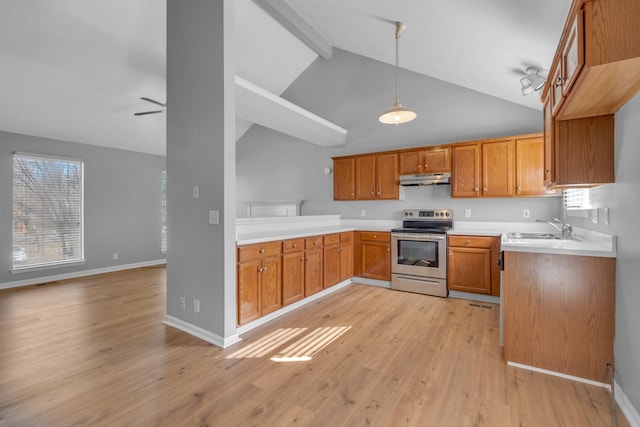 kitchen featuring electric stove, sink, light hardwood / wood-style flooring, ceiling fan, and hanging light fixtures