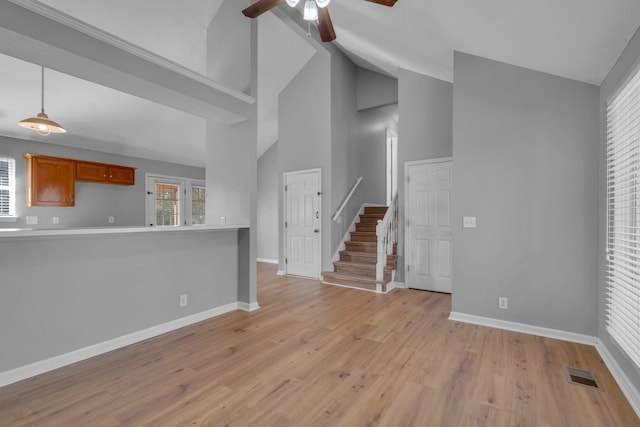 unfurnished living room featuring ceiling fan, high vaulted ceiling, and light hardwood / wood-style flooring