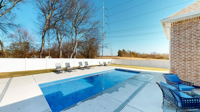 view of pool featuring a patio area