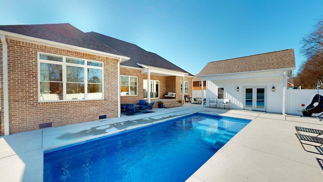 view of swimming pool featuring a patio