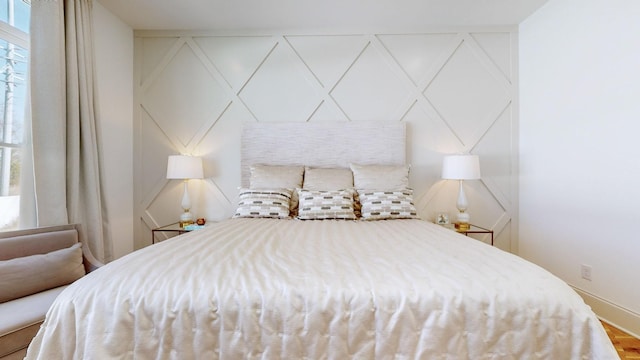 bedroom with wood-type flooring