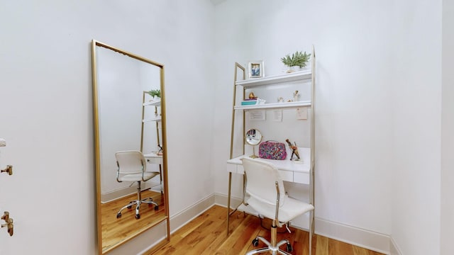 office space with light hardwood / wood-style flooring