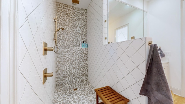 bathroom with tiled shower