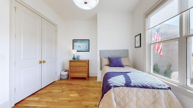 bedroom with light hardwood / wood-style floors