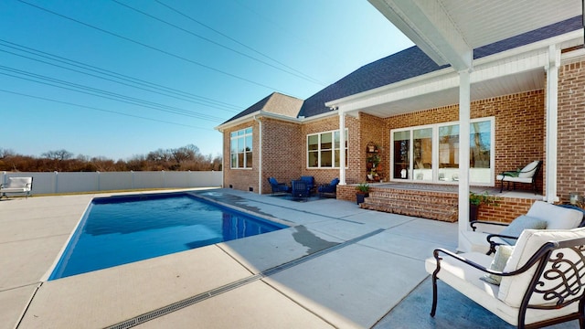 view of pool featuring a patio area