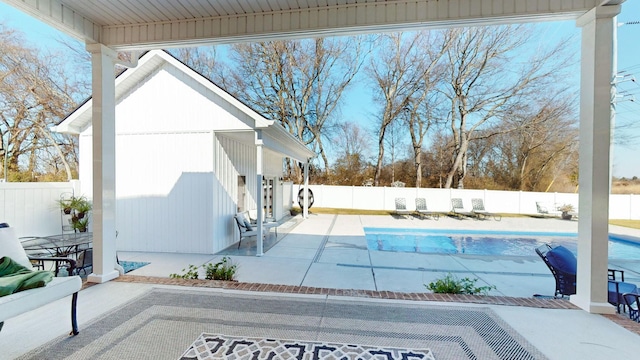 view of swimming pool featuring a patio area