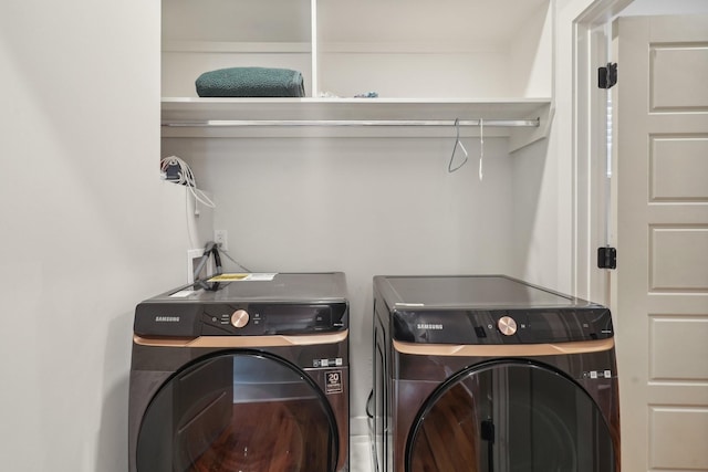 washroom with washing machine and dryer