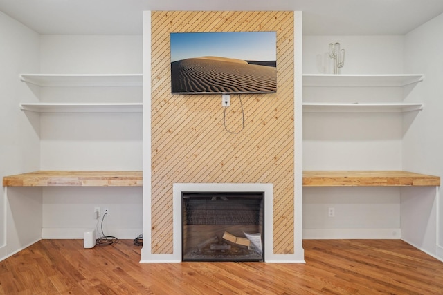 details featuring hardwood / wood-style flooring and built in desk