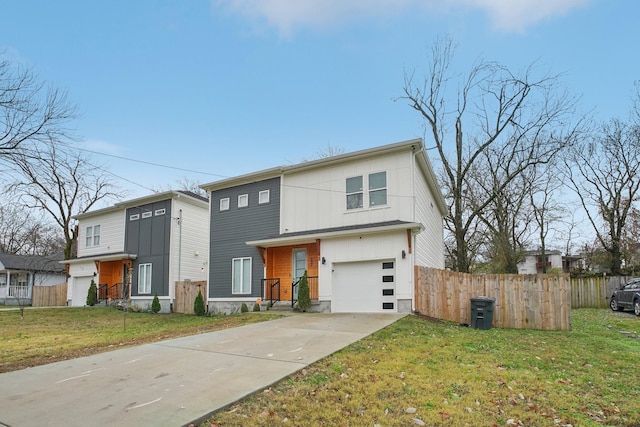 view of front facade with a garage and a front lawn