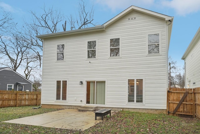 rear view of property featuring a patio