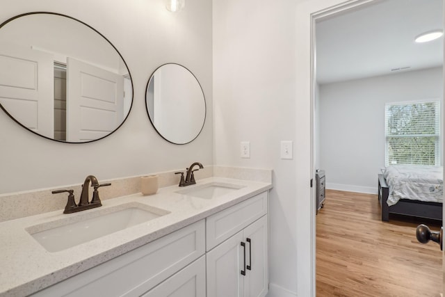 bathroom featuring vanity and hardwood / wood-style floors