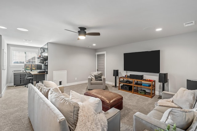 carpeted living room featuring ceiling fan