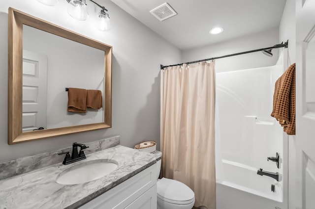 full bathroom featuring vanity, toilet, and shower / bathtub combination with curtain