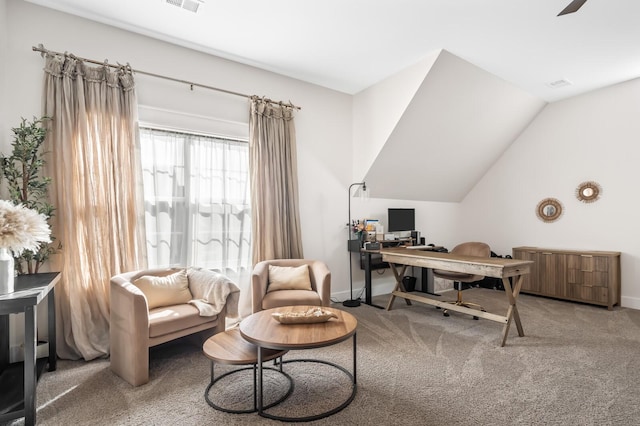 home office featuring carpet floors and vaulted ceiling