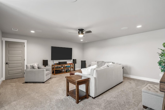 carpeted living room with ceiling fan