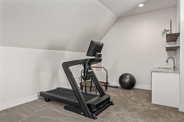 workout room with lofted ceiling, sink, and carpet floors