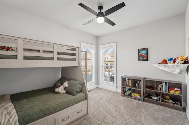 bedroom with light colored carpet and ceiling fan