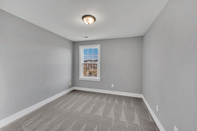 unfurnished room featuring carpet flooring