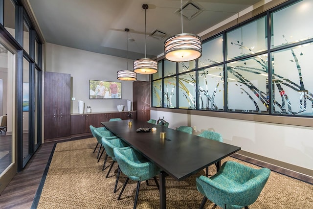 dining area with dark hardwood / wood-style flooring