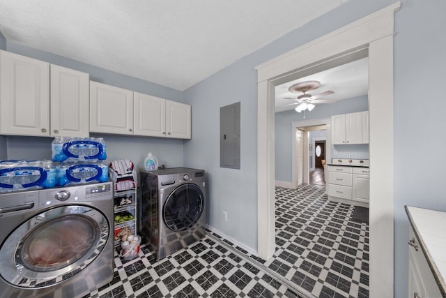 washroom featuring cabinets, ceiling fan, electric panel, and independent washer and dryer