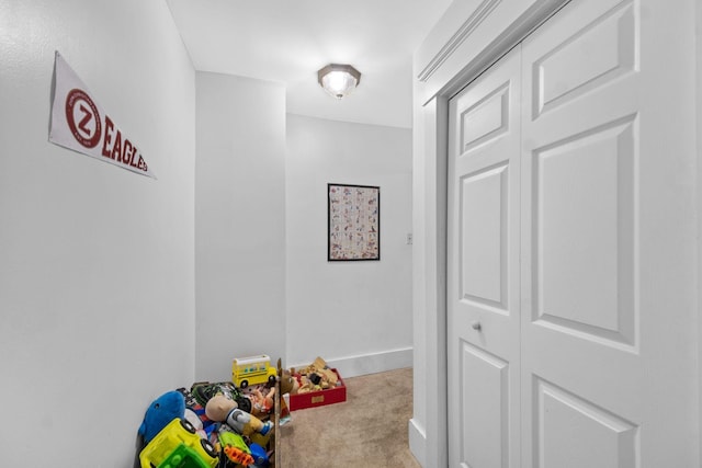 playroom featuring light carpet