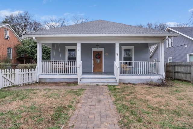 bungalow-style house featuring a front lawn and a porch