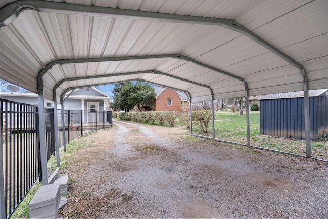 view of parking / parking lot featuring a carport