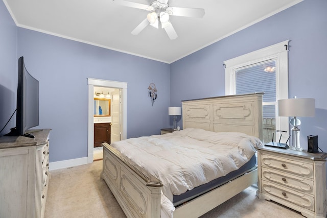 bedroom with crown molding, ceiling fan, ensuite bathroom, and light carpet