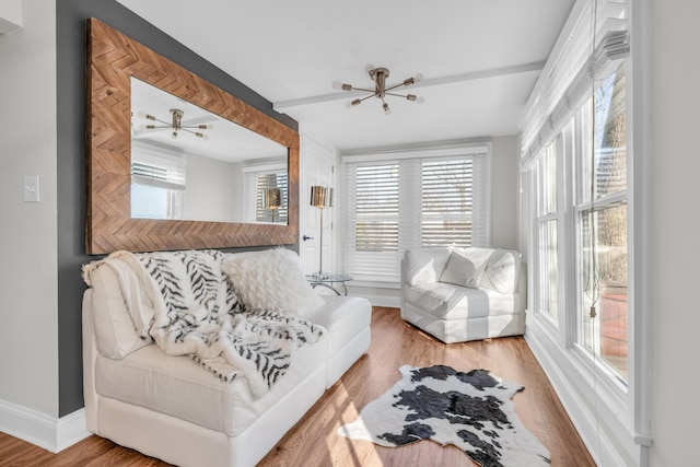 living room featuring wood-type flooring and beam ceiling