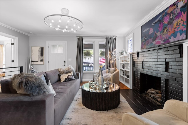 living room featuring crown molding, a fireplace, and wood-type flooring