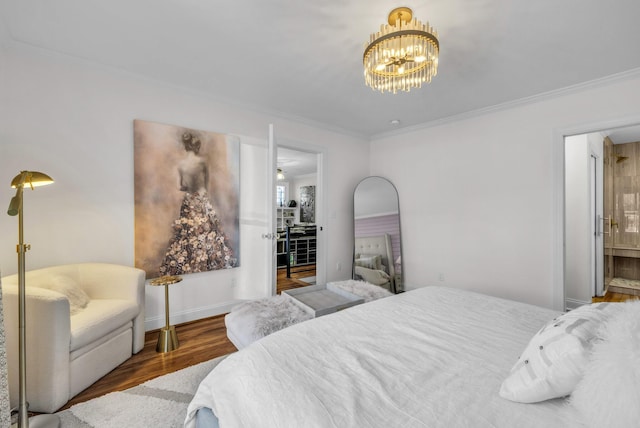 bedroom featuring hardwood / wood-style flooring, ornamental molding, and an inviting chandelier