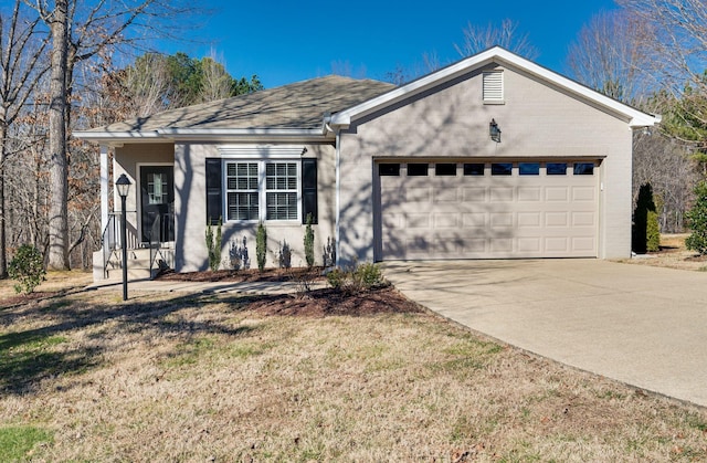 ranch-style home with a garage and a front yard