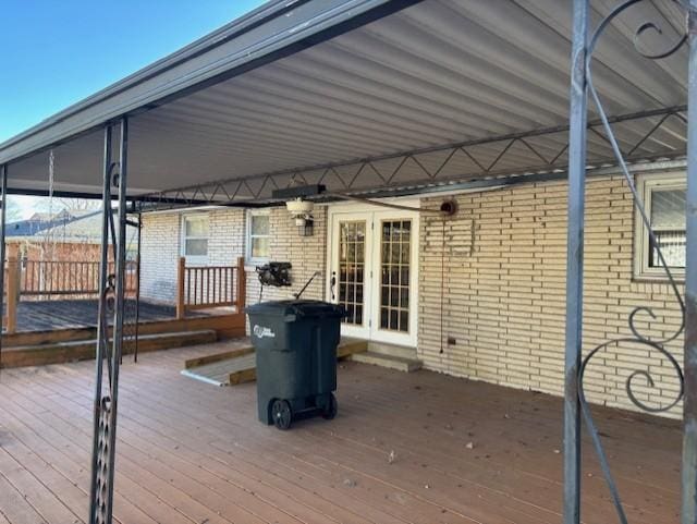 wooden deck featuring french doors