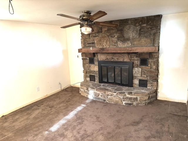 unfurnished living room featuring ceiling fan, a fireplace, and carpet floors