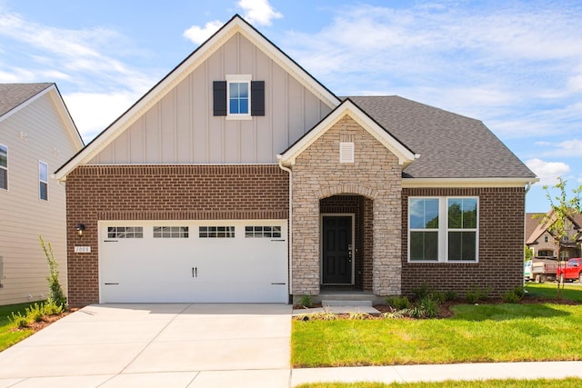 view of front of property featuring a garage and a front lawn