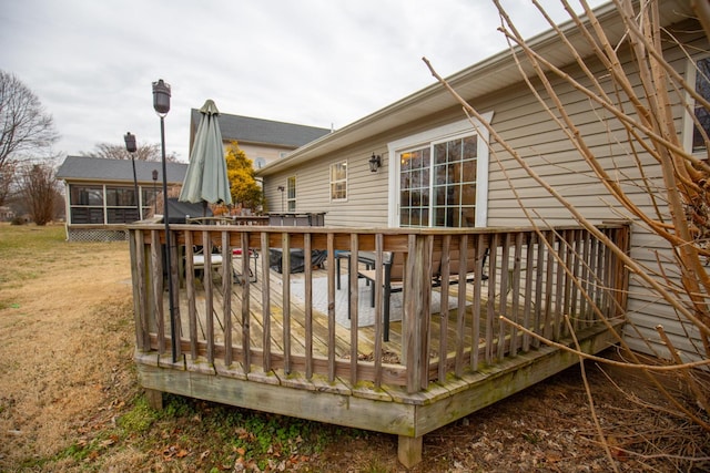 deck with a sunroom