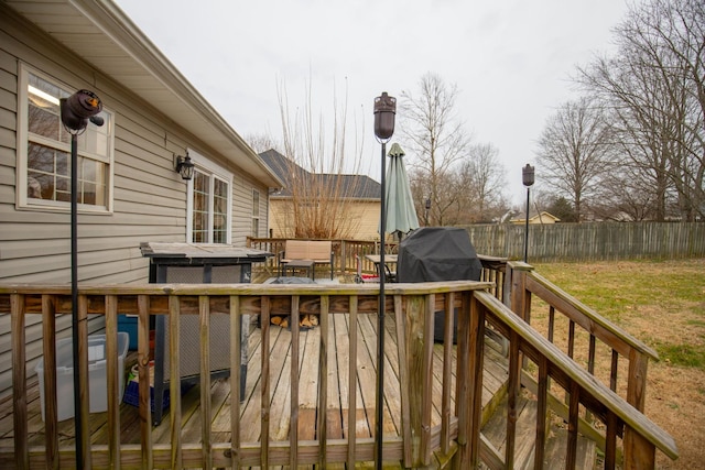 deck featuring grilling area and a jacuzzi