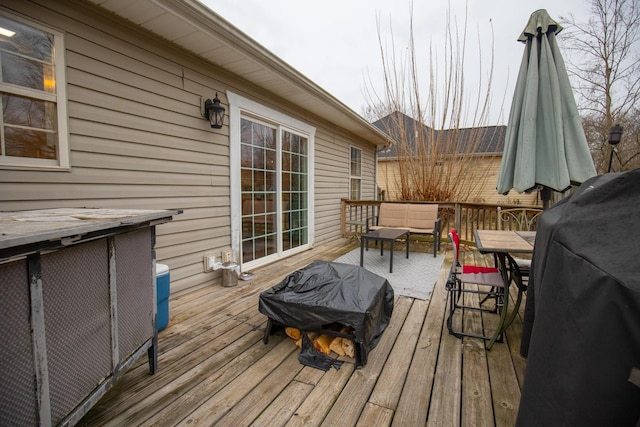 wooden deck featuring area for grilling