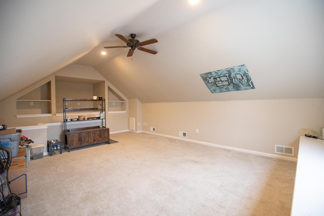 additional living space with ceiling fan, lofted ceiling, and carpet floors