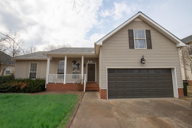 view of front of home featuring a porch, a garage, and a front lawn