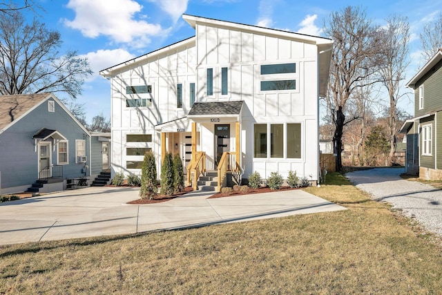 modern inspired farmhouse with board and batten siding and gravel driveway