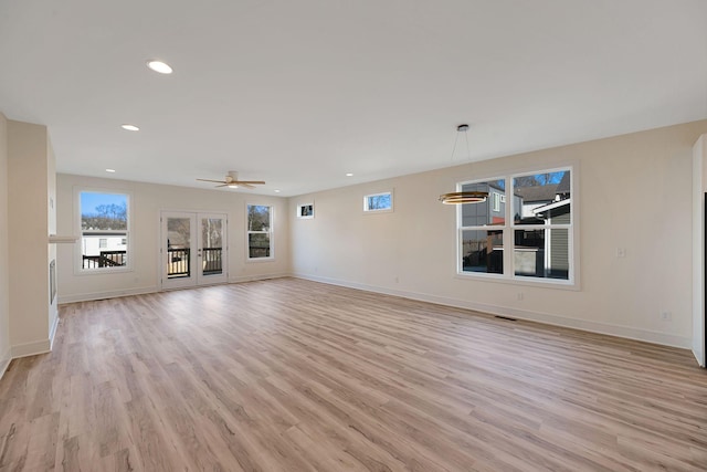 unfurnished living room with recessed lighting, visible vents, light wood-style flooring, ceiling fan, and baseboards