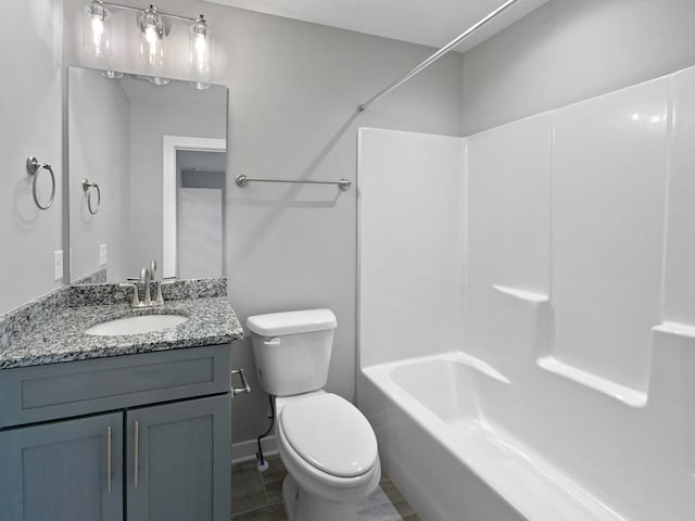 full bathroom featuring vanity, tile patterned floors, toilet, and shower / bath combination