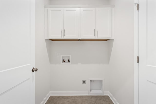 laundry area featuring electric dryer hookup, washer hookup, and cabinets