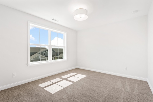 empty room featuring carpet floors