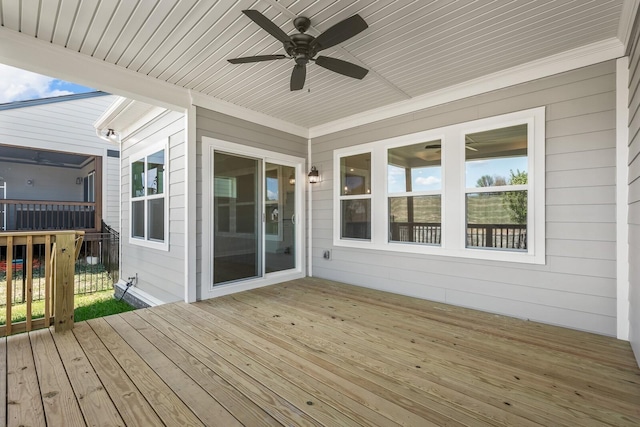 wooden terrace featuring ceiling fan