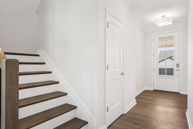 interior space with hardwood / wood-style flooring and ornamental molding