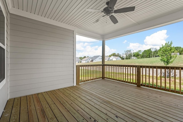 deck with ceiling fan and a lawn